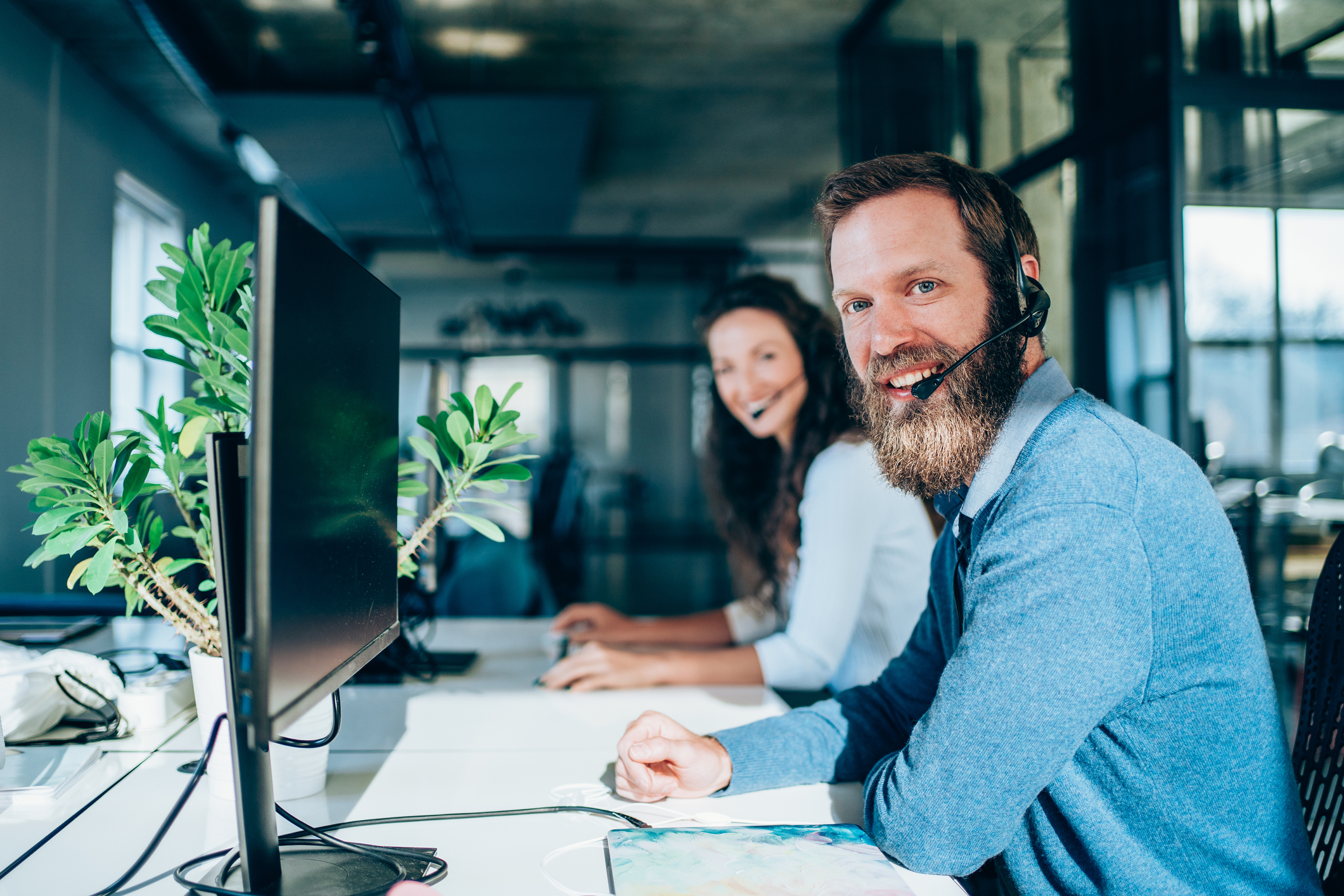 Call centre workers at their workstations
