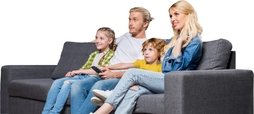 Family sitting on couch watching TV