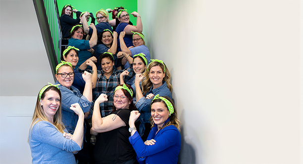 group photo of woman flexing on a staircase