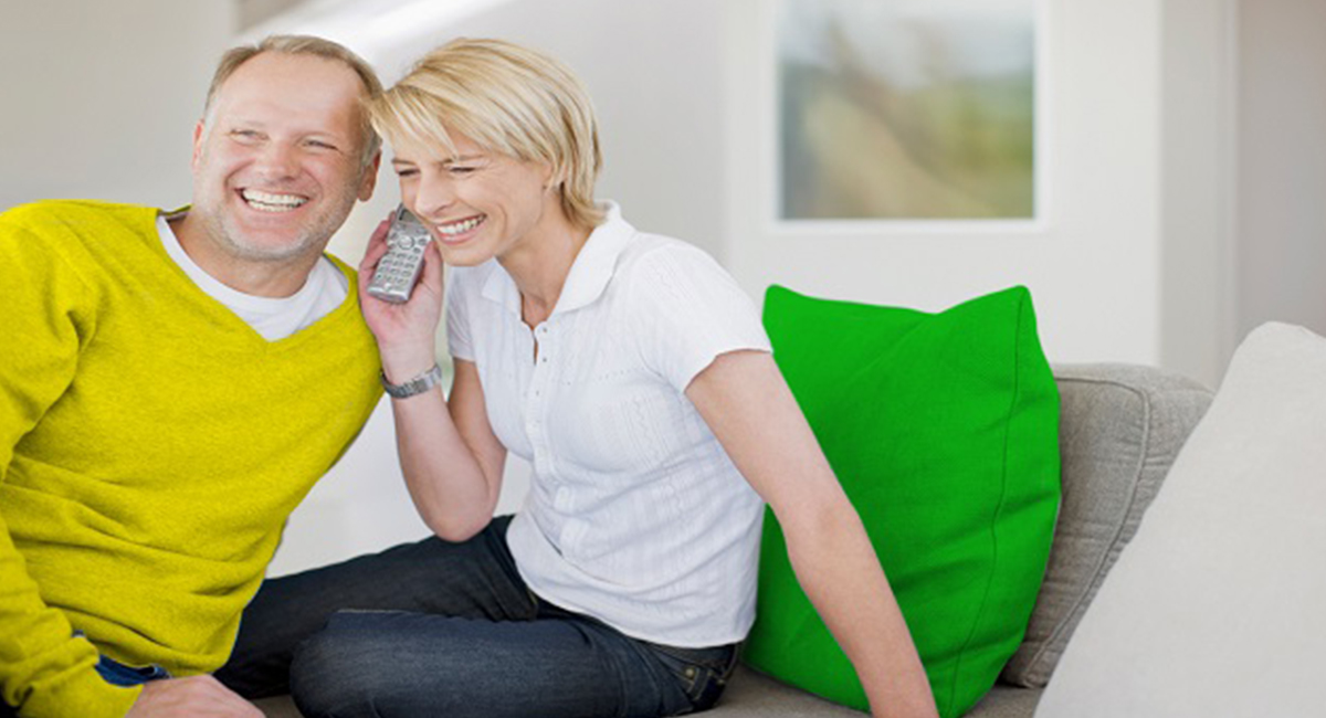 A couple listening to phone