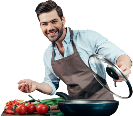 Man smiling breaking fourth wall cooking with frying pan