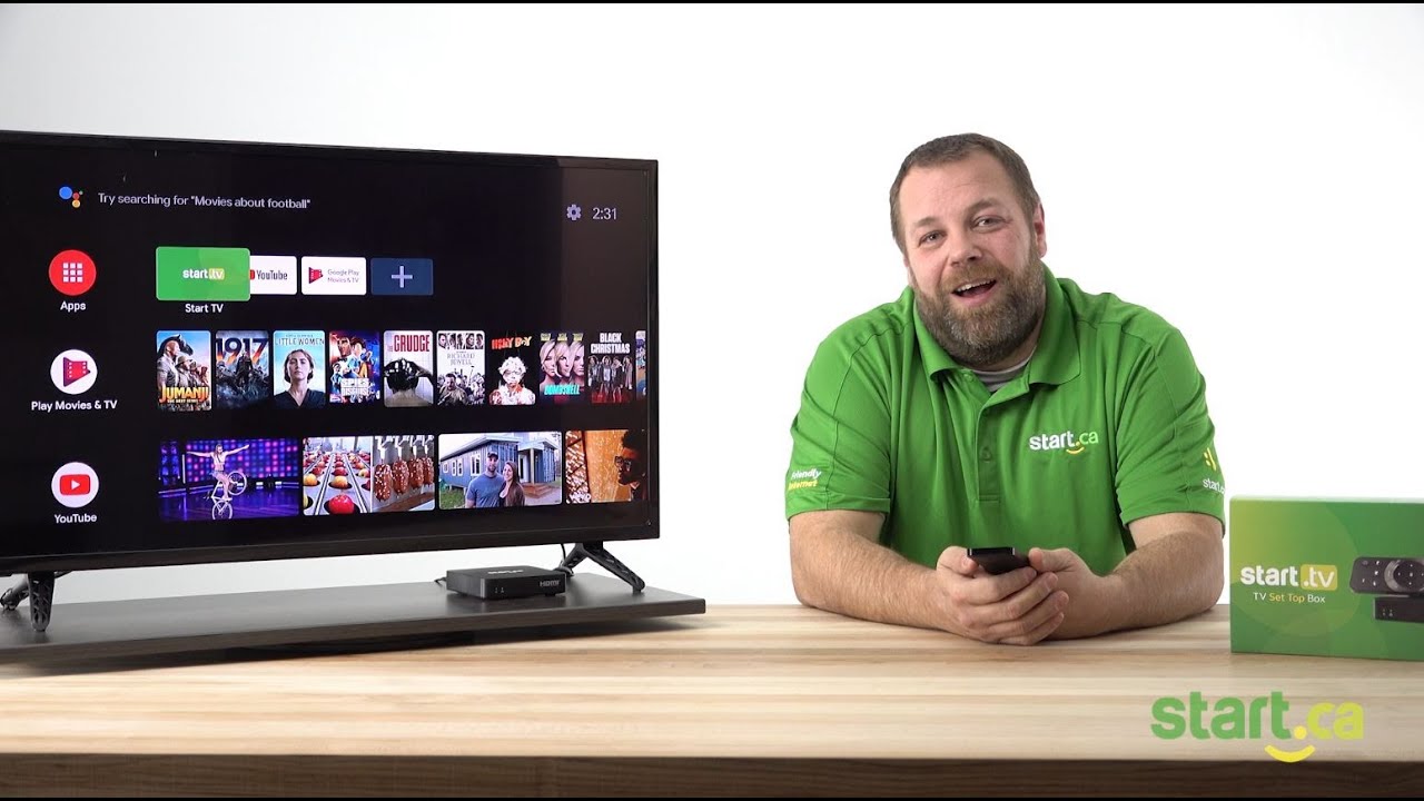 Presenter sitting beside a monitor