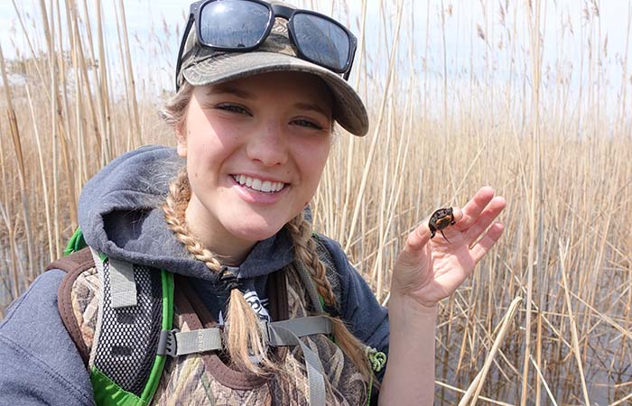 Girl holding a turtle