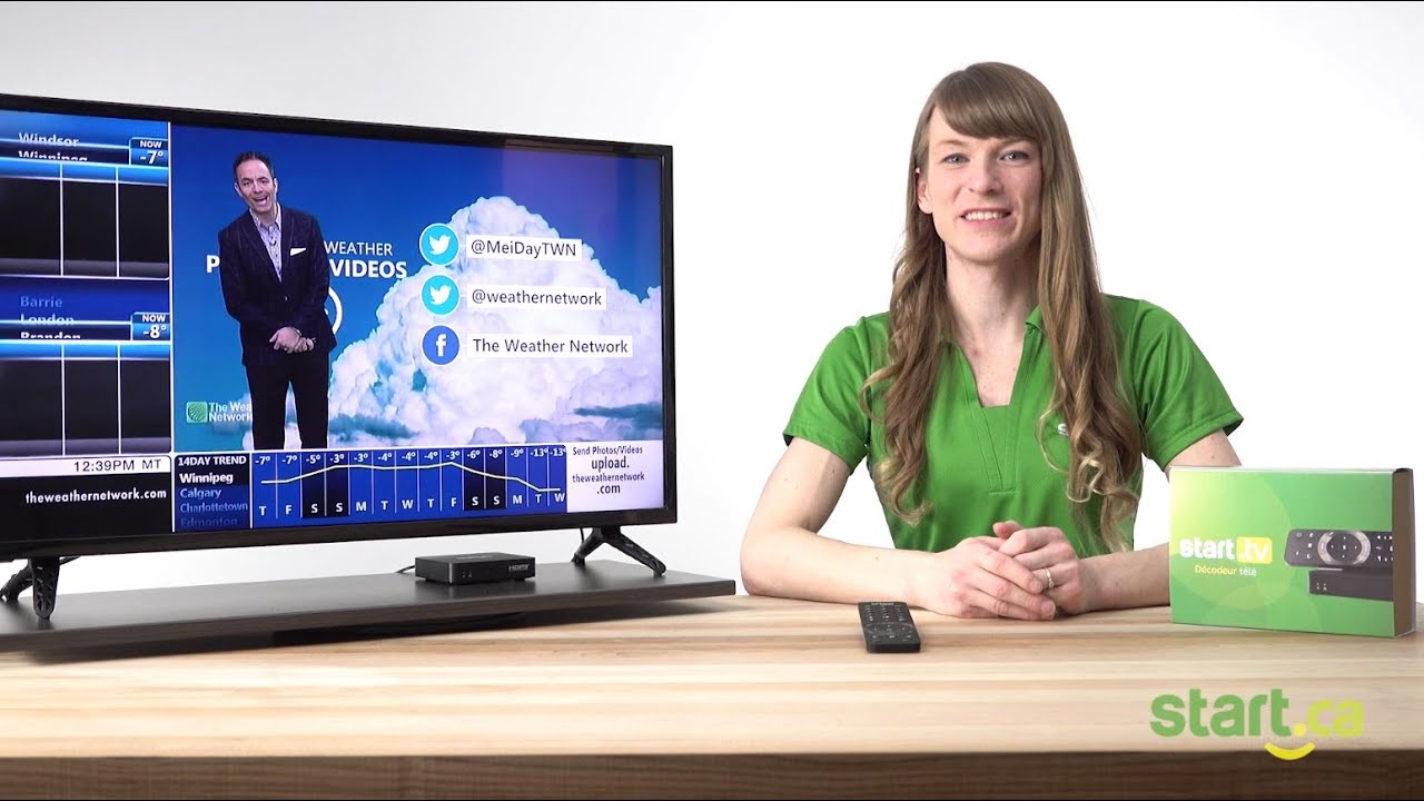Woman smiling at camera explaining closed caption while the Weather Network is on TV